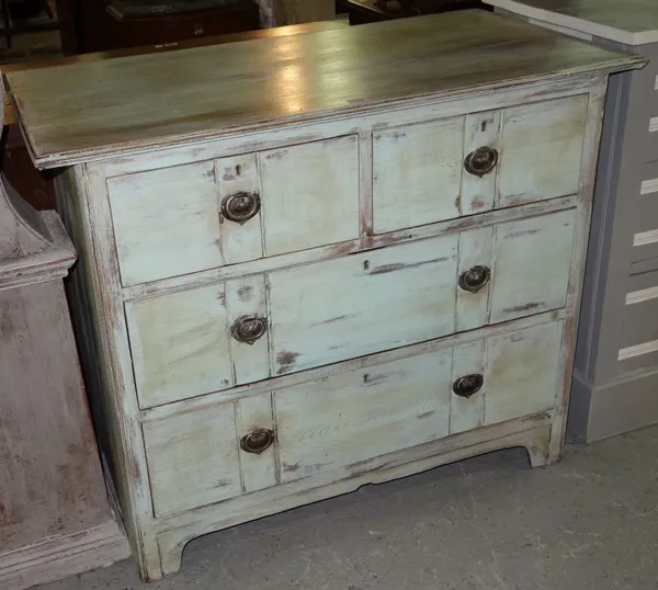 A green painted oak chest of two short and two long drawers.