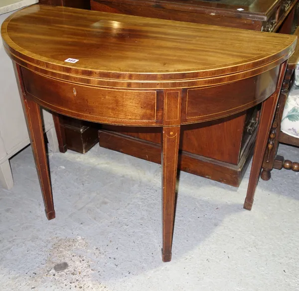 A George III inlaid mahogany demi lune tea table with single frieze drawer.