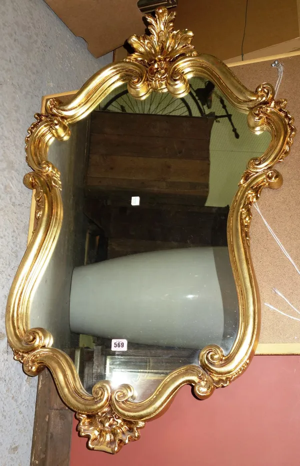 A 20th century giltwood wall mirror, together with four further mirrors. (5)