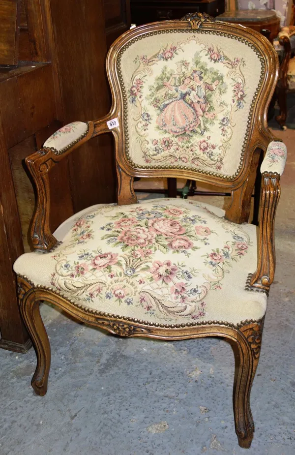 A carved oak Louis XV style oak armchair.