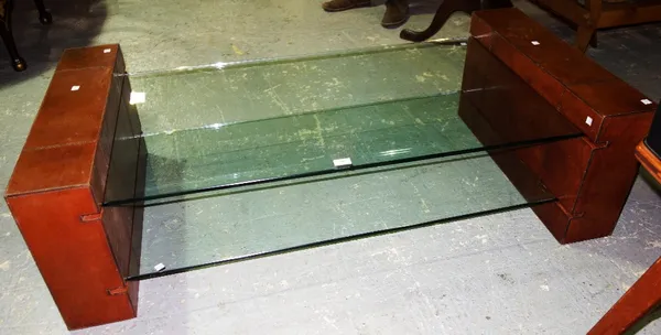 A 20th century leather and glass coffee table.