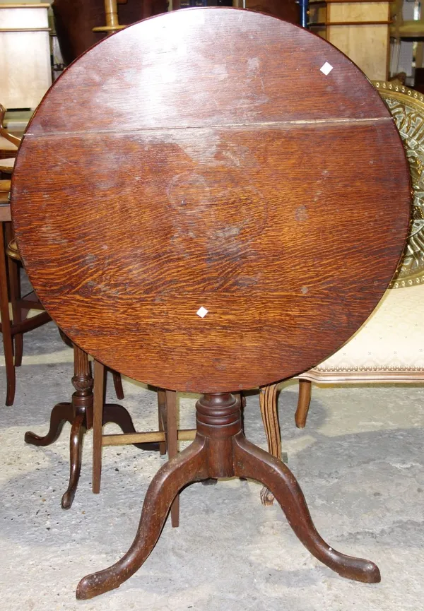 An early 19th century oak tripod table.