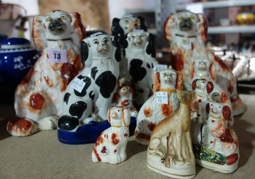 A group of ten Staffordshire pottery spaniels and a Staffordshire greyhound. (11)