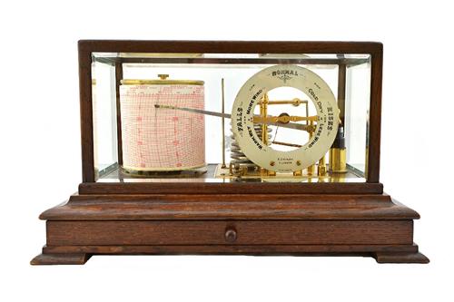 An oak cased barograph, circa 1900, by R.Stewart of Glasgow, with frieze drawer to the base, 37.5cm high.   Illustrated