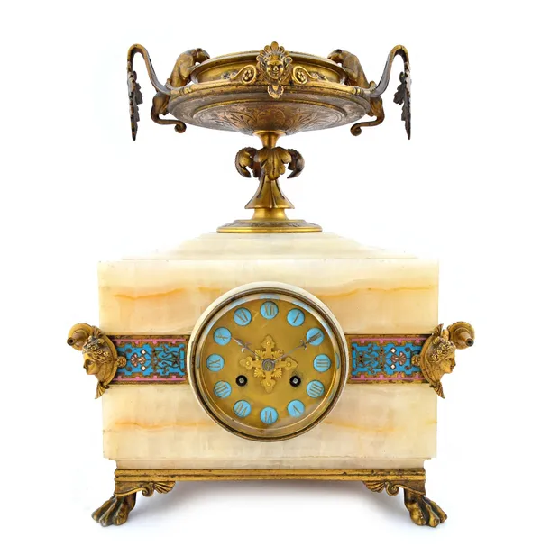 A Napoleon III ormolu and champleve enamel decorated onyx striking mantel clock, circa 1870, the rectangular case surmounted by an urn with foliate ca