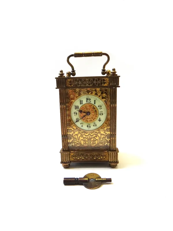 A French gilt brass cased carriage clock, early 20th century, with enamelled chapter ring and foliate cast dial plate, with a single movement, 13cm hi