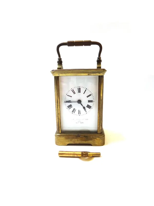 A French gilt brass cased carriage clock, early 20th century, with indistinctly signed white enamel dial and two train movement, 11.5cm high.