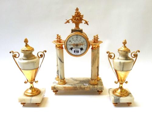 A Continental marble and ormolu mounted clock garniture, late 19th century (re-gilded), the drum supported on four pillars on a rectangular plinth and