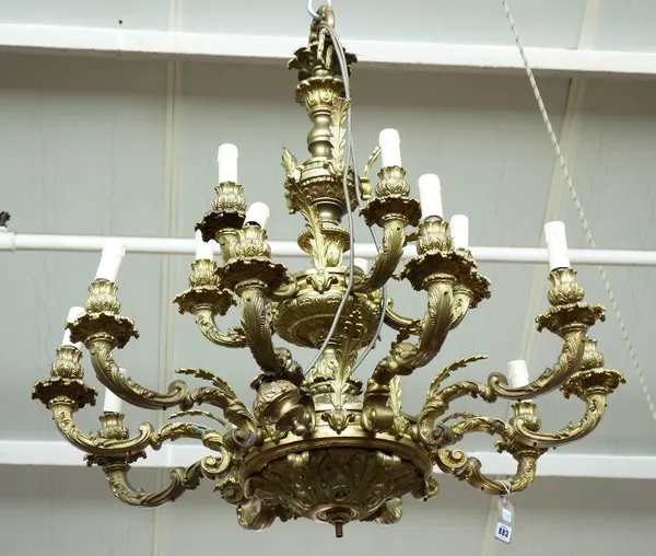 A Louis XVI style gilt bronze fifteen branch chandelier, 20th century, the foliate cast tapering stem issuing fifteen 'S' scroll branches over two gra