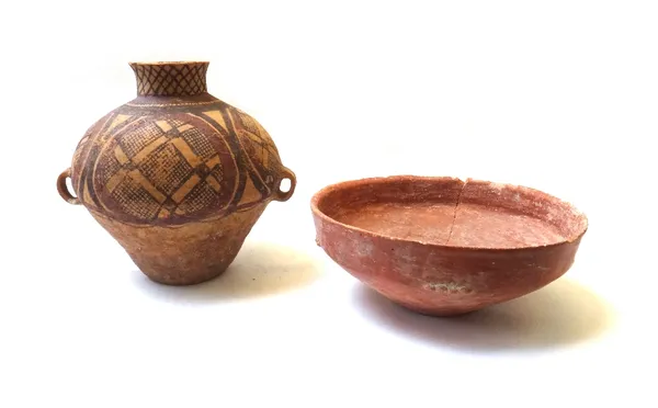 A two handled pottery jar, possibly Greek (Magna Graccia) Apulian, decorated with geometric patterns (24cm high) and a burnished red bible lands bowl