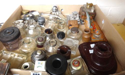 A 1950's Bakelite desk inkwell, 15cm wide, a white metal and faux tortoiseshell capstan inkwell, a glass and brass inkwell in a coopered oak brass bou