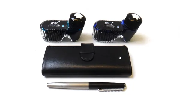 A Montblanc fountain pen with matte finish metal body, 13.5cm, in a leather case, and two bottles of Montblanc ink. (3)