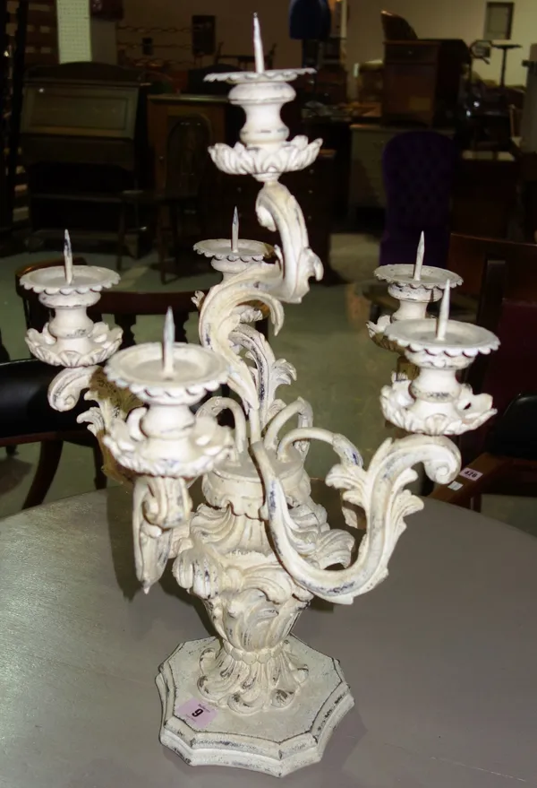 A white painted five branch candelabra.