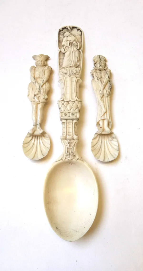 Three 19th century ivory spoons, the smaller pair with figural carved handles and shell bowls, 12.5cm. The larger handle carved with a figure of Chris