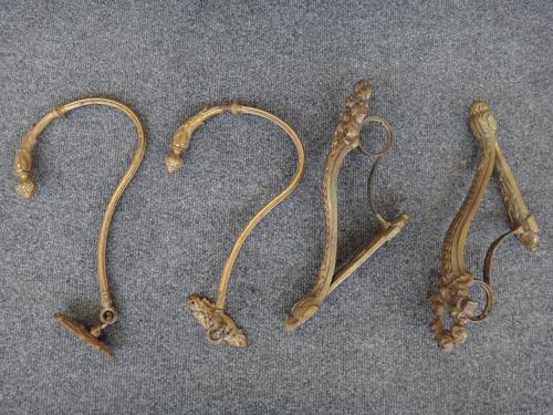 Two similar pairs of brass curtain pole holders with a pair of tie-backs, a Steiff 'Steamboat Willie', boxed, a pair of porcelain candlesticks, a door