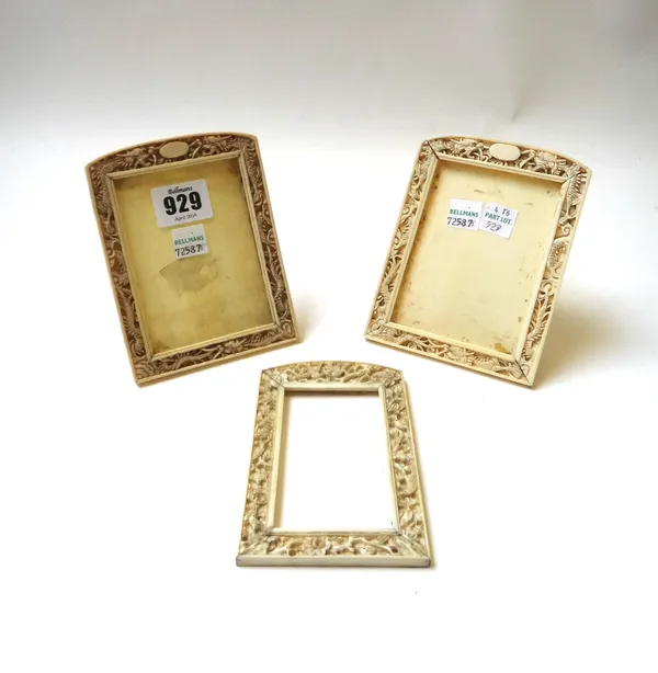 A pair of Chinese carved ivory photo frames, 12.5cm high, and another similar smaller frame. (3)