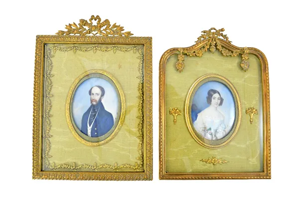 Michele Albanesi (1816-1878) Italian, a pair of portrait miniatures on ivory depicting a husband and wife, each in a water silk mounted strut back gil