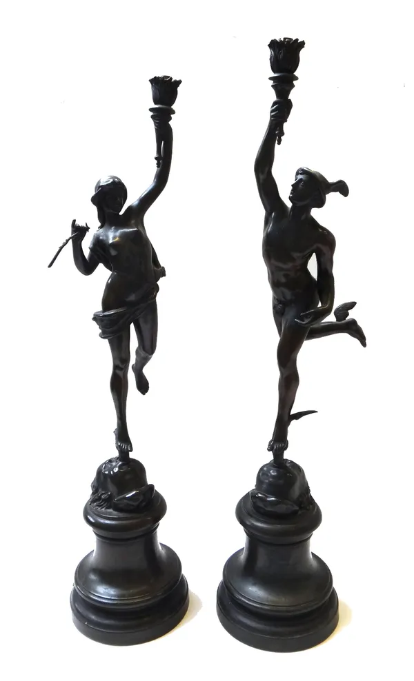 A pair of bronzed spelter figural table lamps, early 20th century, each cast as a classical figure on an integral socle (a.f), 76cm high. (2)