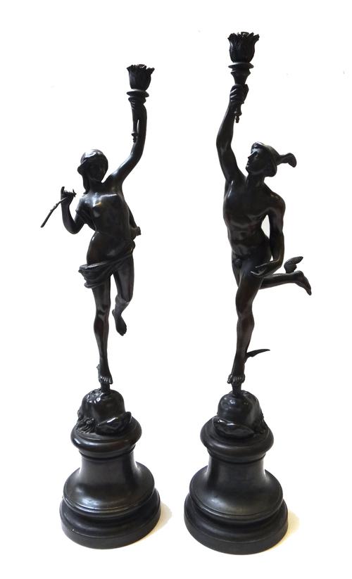 A pair of bronzed spelter figural table lamps, early 20th century, each cast as a classical figure on an integral socle (a.f), 76cm high. (2)