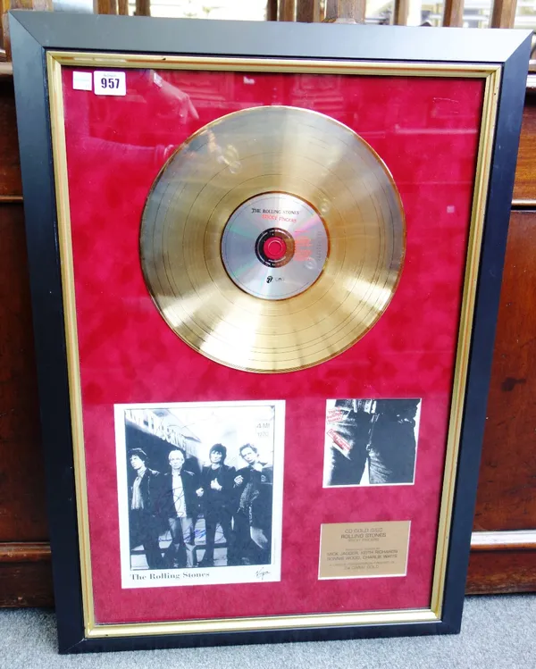 A Rolling Stones presentation record 'Sticky Fingers' with signed black and white photograph, framed and glazed as one, 78cm x 54cm.
