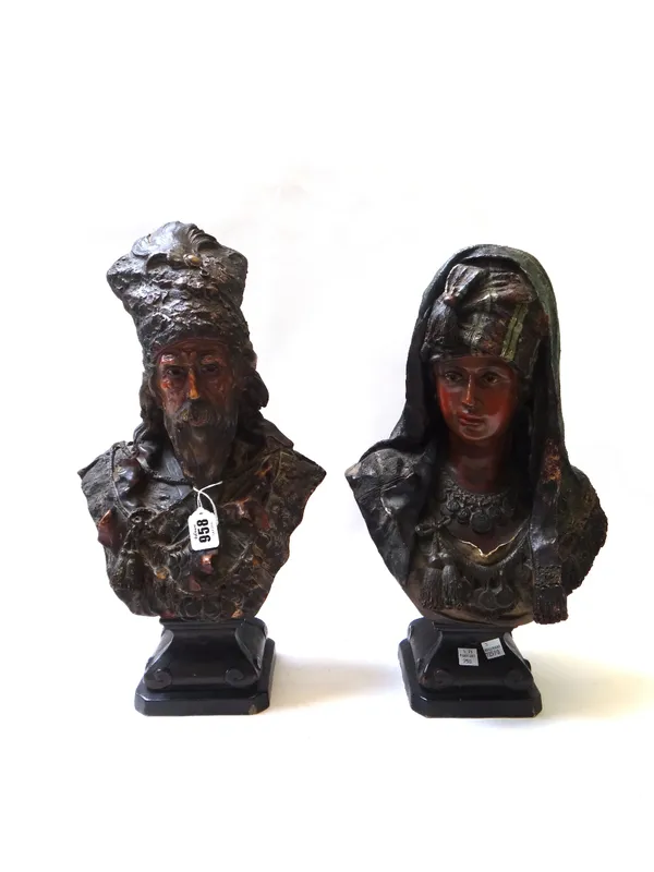 A pair of Continental terracotta busts, late 19th century, each modelled as gypsies on square canted bases, incised numbers and retailer's paper label