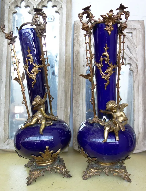 A pair of Continental blue ground pottery vases, early 20th century, with brass foliate and figural mounts (a.f), 53cm high, together with an Art Nouv