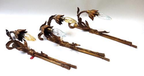 A gilt bronze, foliate cast two branch wall applique, 20th century, and two matching single branch wall appliques (a.f), 54cm high. (3)