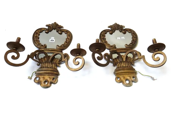 A pair of gilt bronze two branch girandole wall lights, 20th century, with shaped mirror backplates, 48cm high, and a modern gilt metal and glass two