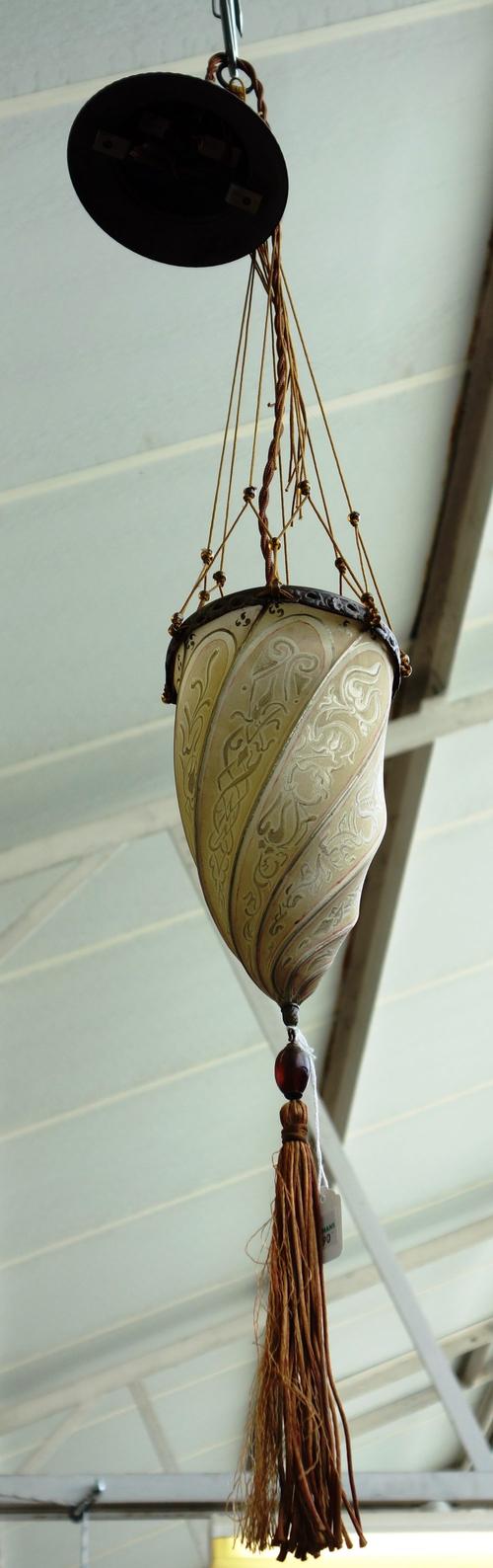 A pair of Persian lanterns, early 20th century, with patinated copper ceiling boss over spiral silk shades painted with foliate script and suspended b
