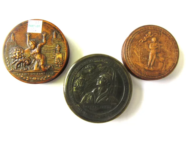 A horn circular snuff box, 19th century, relief carved with Robert Burns within a border of moral verse (8.5cm diameter) and two circular carved wood