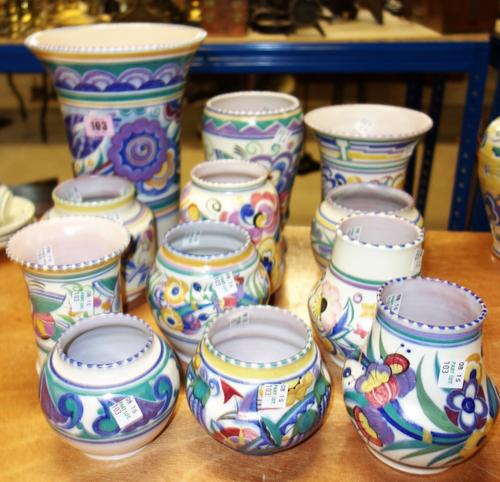 A quantity of Poole pottery to include;  Large flared vase decorated by HE and 11 other vases (12)