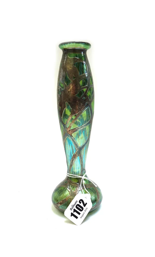 An iridescent green glass and silver overlaid vase, probably Loetz, circa 1900, the silver overlay of foliate form, 21cm high.