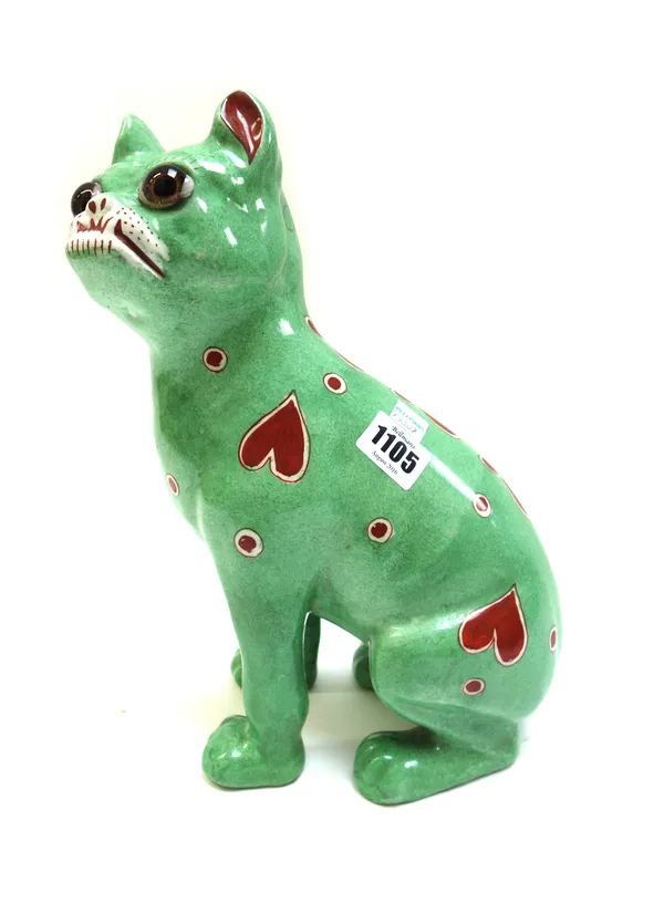 A Gallé style earthenware pug dog, probably Mosanic, Germany, circa 1900, green glaze with stylised heart decoration (a.f), 30cm high.