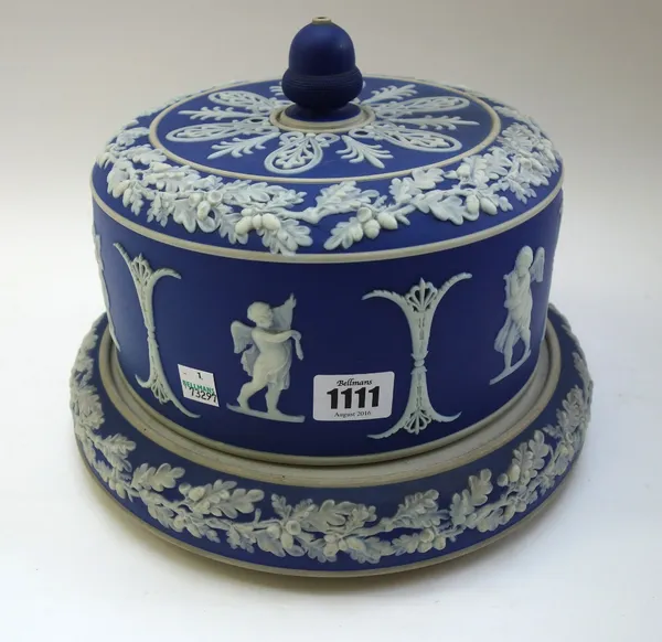A blue Jasper cylindrical cheese dome and stand, perhaps Dudson, late 19th century, sprigged in white with a frieze of putti between oak leaf borders,