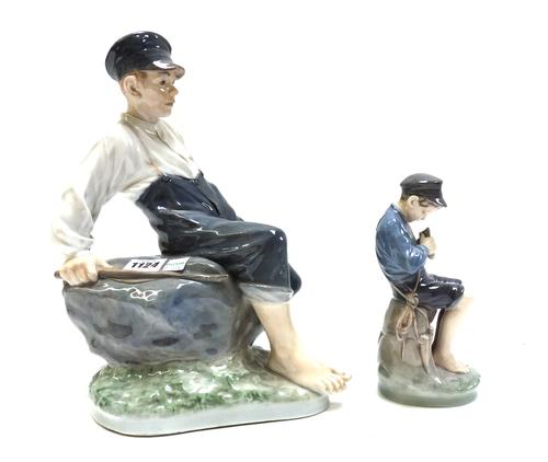 A Royal Copenhagen porcelain figure, 'Shepherd boy on a rock', modelled by Christian Thomsen, numbered 1659, 30cm high, and one other Royal Copenhagen