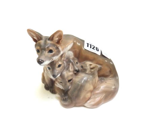 Five Royal Copenhagen animal groups, comprising; foxes no.946, another single fox no.946, a pair of doves no.402, a rabbit no.1252, and a puppy no.123