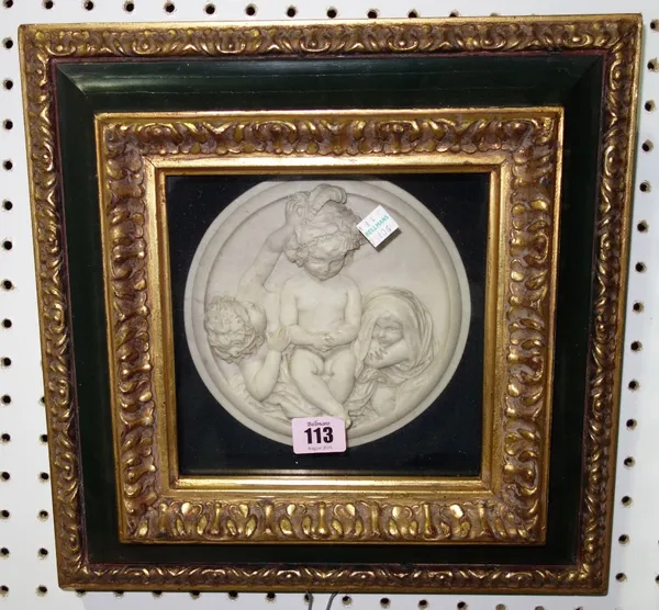 A 20th century framed and glazed circular marble relief carved plaque, depicting cherubs.