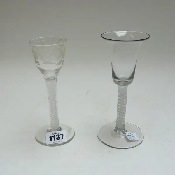 An opaque twist wine glass, circa 1765, the ogee bowl engraved with flowers, raised on a double series opaque twist stem and plain foot, 15cm.high; an