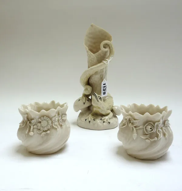 A Belleek porcelain vase, relief moulded with a lizard atop a naturalistic base, with black printed mark, 22cm high, and a pair of Belleek porcelain v