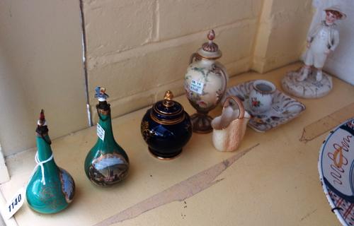 A pair of Chamberlain's Worcester green ground scent bottles, late 19th century, the stoppers modelled as butterflies, the bodies decorated with 'Malv