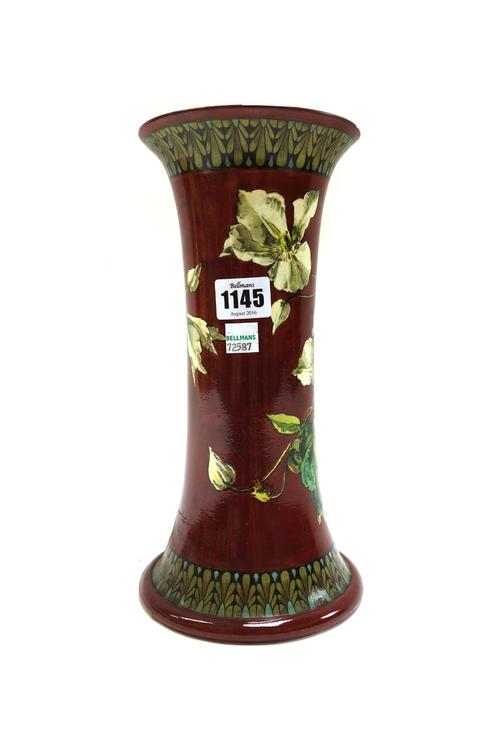 A Doulton Lambeth faience vase by Helen Arding, late 19th century, of waisted form, decorated with flowers against a brown ground, with impressed and