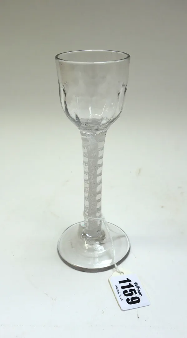 An opaque twist wine glass, circa 1765, the moulded ogee bowl raised on a double-series opaque twist stem and plain foot, 16cm.high.