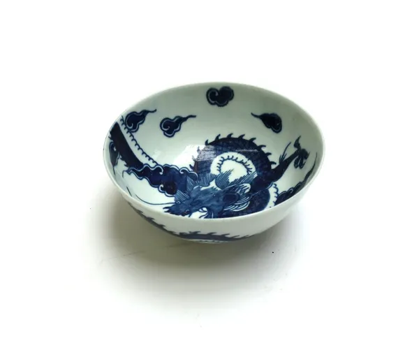 A small Worcester porcelain bowl, circa 1758-60, painted in underglaze-blue with the `Dragon' pattern, with blue workman's mark, 12cm.diameter.