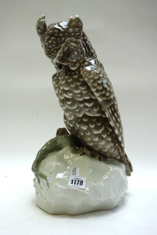 An Amphora pottery owl, 20th century, model no.8272, modelled and perched atop a rock, with incised and impressed marks, 36cm high.