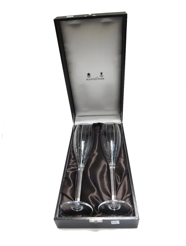 Mappin & Webb; a cased decanter and stopper, and two pairs of champagne flutes, together with two sets of six Bohemia crystal wine glasses, all boxed.