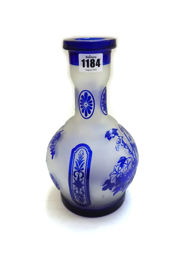 A blue overlay glass bottle vase, late 19th/early 20th century, decorated with bamboo and foliate panels, 25.5cm high.