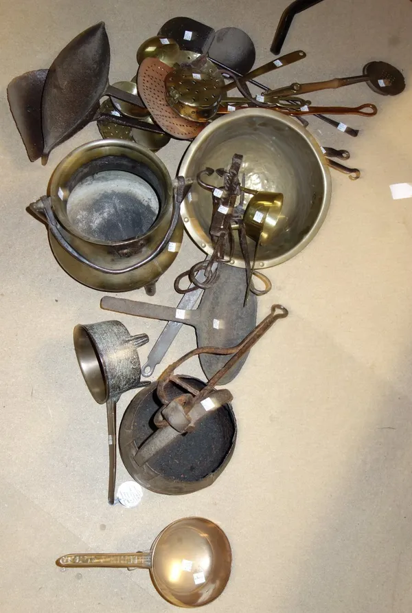 Kitchenalia metalware including; two 17th century and later skillets, cauldron, late 17th century fireside hanging pot, assorted skimmers, spoons and