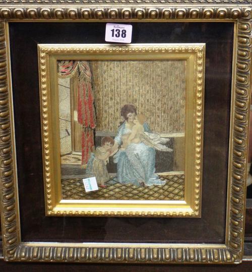 An early 19th century silkwork picture of a mother and children in an interior.