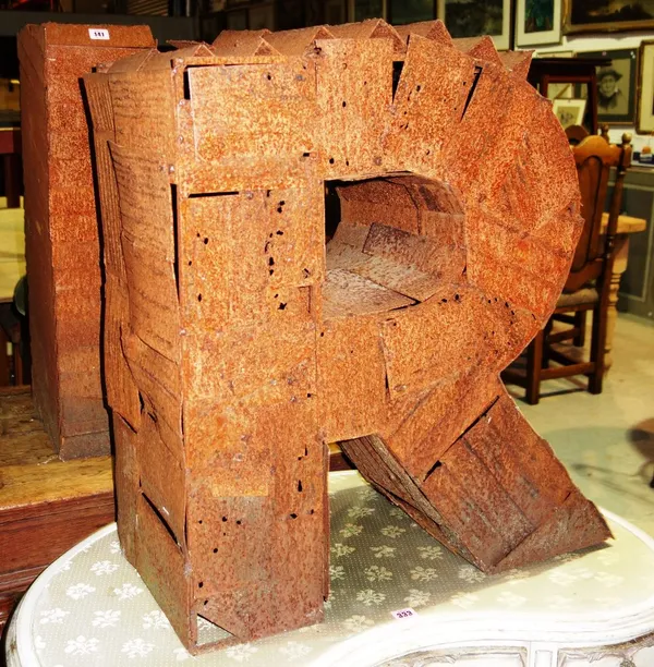 A pair of large iron three dimensional letters; 'K' and 'R'. (2)