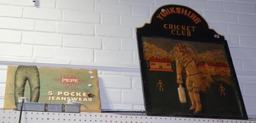 A 20th century painted relief moulded sign for 'Yorkshire Cricket Club' and a small advertising sign, (2).